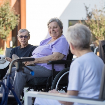 Residents socializing on the private outdoor courtyard
