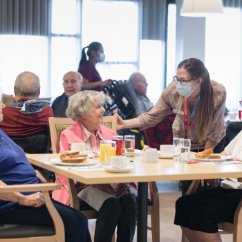 Dietitian checks in with residents during lunch